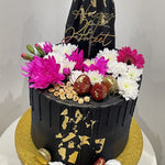 BLACK ELEGANCE FLORAL DRIP CAKE