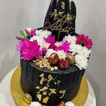 BLACK ELEGANCE FLORAL DRIP CAKE