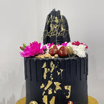 BLACK ELEGANCE FLORAL DRIP CAKE