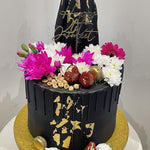 BLACK ELEGANCE FLORAL DRIP CAKE