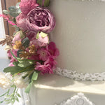 WHITE PILLAR FLORAL WEDDING CAKE